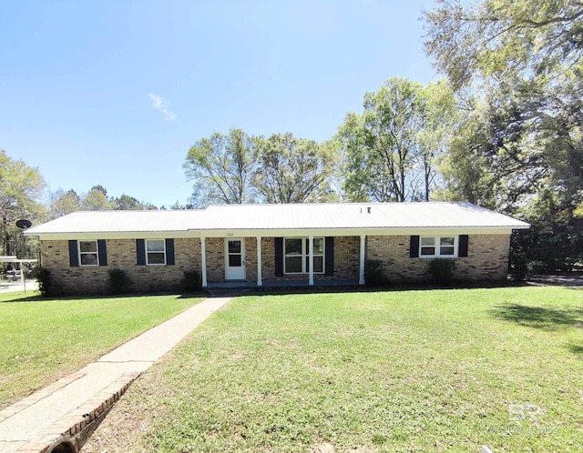 single story home featuring a front lawn and covered porch