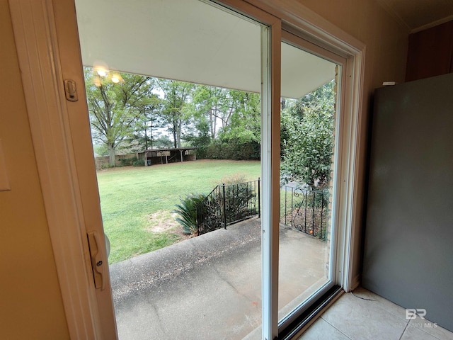 doorway with light tile patterned flooring