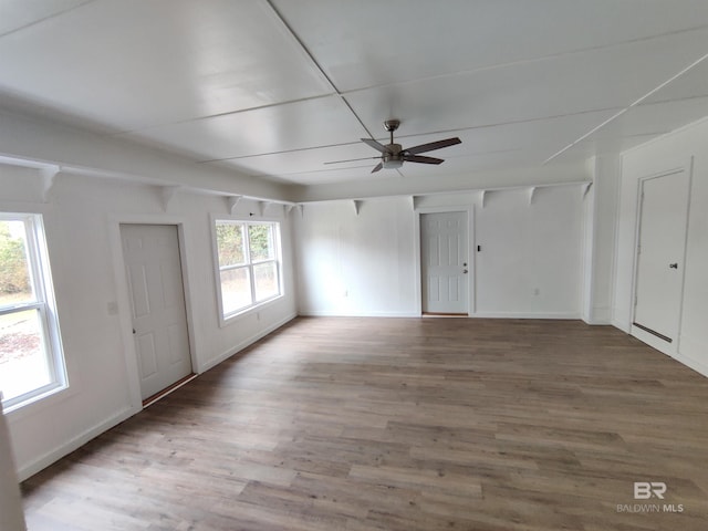 spare room with hardwood / wood-style floors and ceiling fan