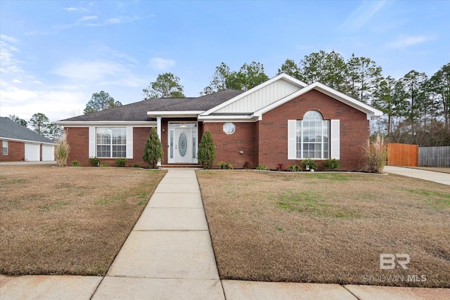 ranch-style home featuring a front yard