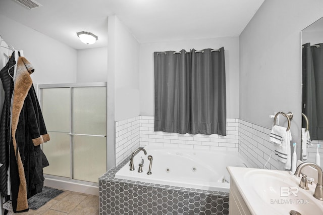 full bath featuring visible vents, a whirlpool tub, tile patterned flooring, vanity, and a shower stall