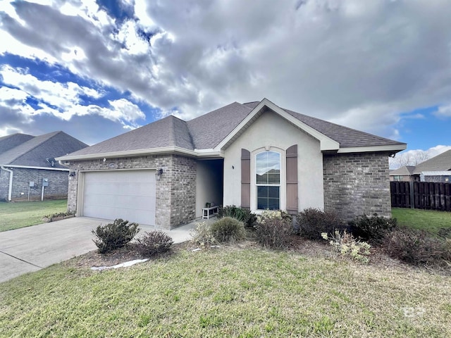 ranch-style home with a garage, brick siding, driveway, roof with shingles, and a front lawn