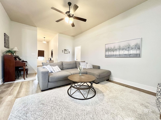 14775 Sonoma Blvd, Silverhill, AL 36576 - living room with a ceiling fan, vaulted ceiling, wood finished floors, and baseboards