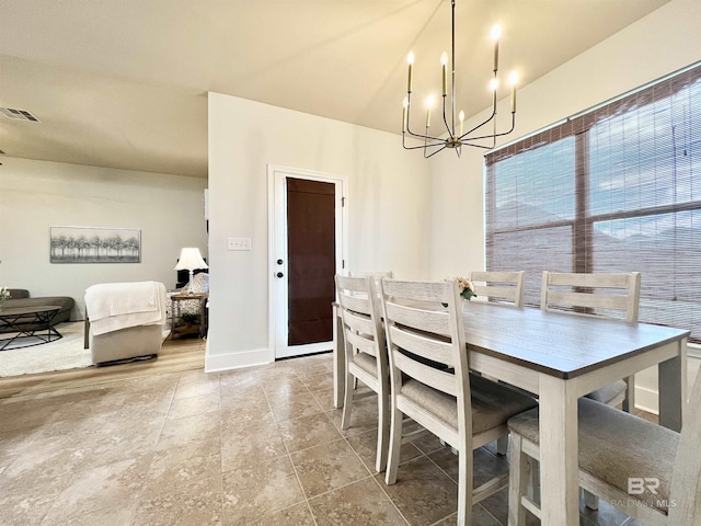 14775 Sonoma Blvd, Silverhill, AL 36576 - dining area featuring a notable chandelier, baseboards, and visible vents