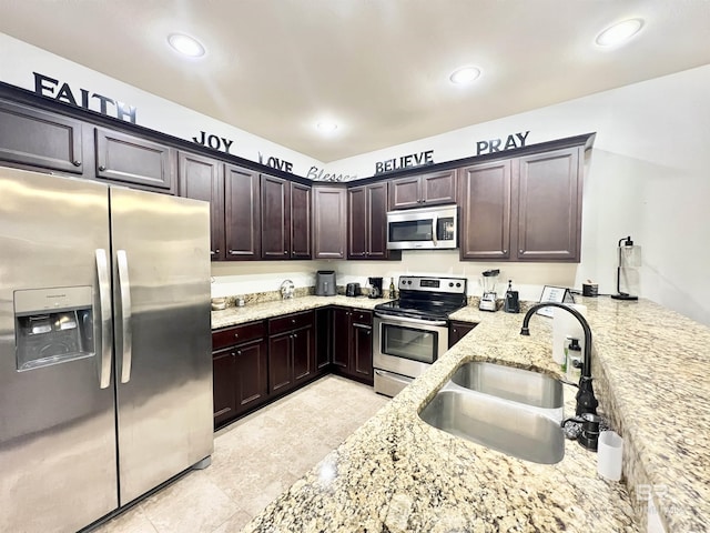 14775 Sonoma Blvd, Silverhill, AL 36576 - kitchen featuring light stone counters, recessed lighting, a sink, stainless steel appliances, and dark brown cabinets