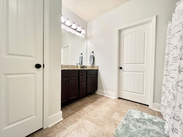 14775 Sonoma Blvd, Silverhill, AL 36576 - bathroom featuring vanity, baseboards, and tile patterned flooring