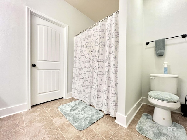 14775 Sonoma Blvd, Silverhill, AL 36576 - full bathroom with a shower with shower curtain, baseboards, toilet, and tile patterned flooring