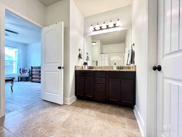 14775 Sonoma Blvd, Silverhill, AL 36576 - bathroom featuring double vanity, baseboards, and a sink