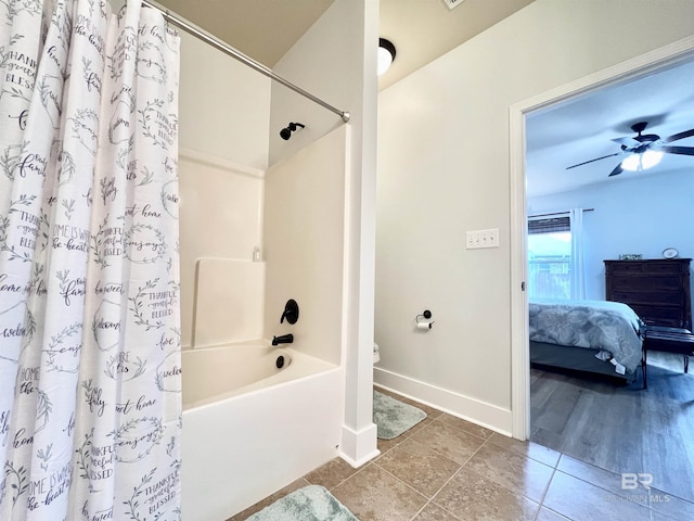 14775 Sonoma Blvd, Silverhill, AL 36576 - bathroom featuring baseboards, shower / bath combo with shower curtain, ensuite bathroom, tile patterned floors, and toilet