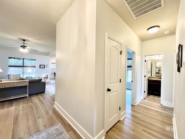 14775 Sonoma Blvd, Silverhill, AL 36576 - hallway with visible vents, baseboards, and light wood finished floors