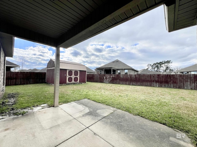 14775 Sonoma Blvd, Silverhill, AL 36576 - view of yard featuring an outdoor structure, a fenced backyard, a shed, and a patio area