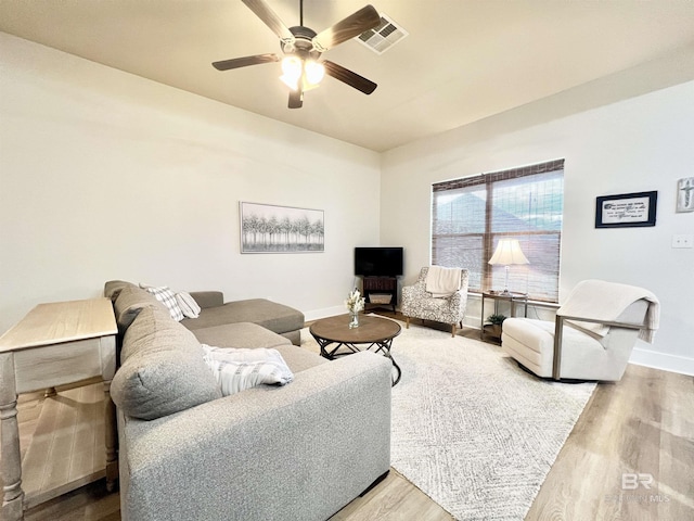 14775 Sonoma Blvd, Silverhill, AL 36576 - living area featuring ceiling fan, visible vents, baseboards, and wood finished floors