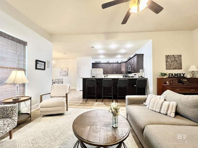 14775 Sonoma Blvd, Silverhill, AL 36576 - living room with light wood finished floors, baseboards, and ceiling fan