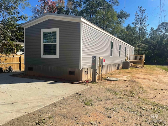 view of side of property with central AC unit