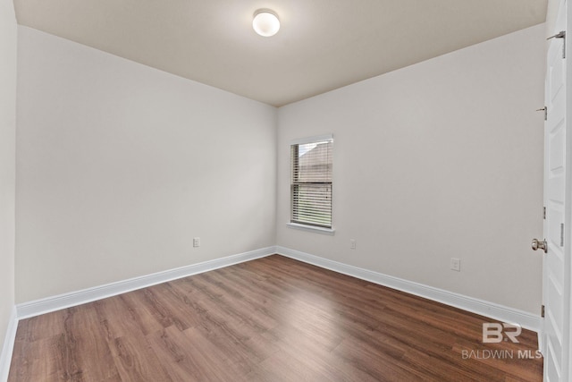 1464 Surrey Loop, Foley, AL 36535 - unfurnished room with wood finished floors and baseboards