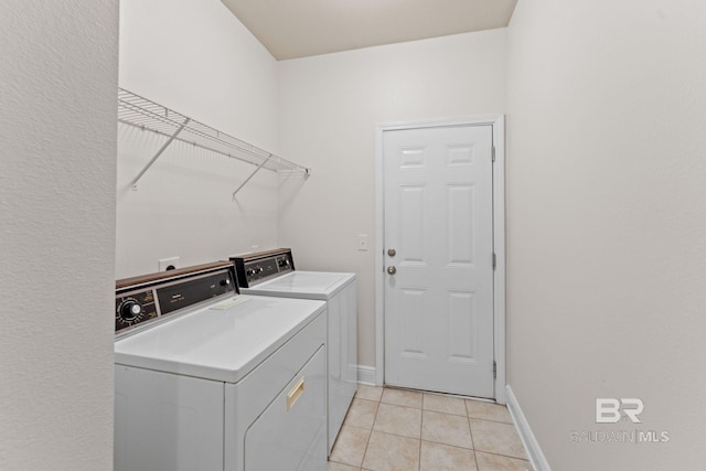 1464 Surrey Loop, Foley, AL 36535 - laundry area with washing machine and clothes dryer and light tile patterned floors