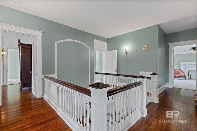 corridor featuring dark hardwood / wood-style flooring