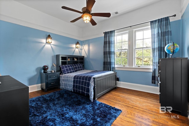 bedroom featuring ceiling fan and wood-type flooring