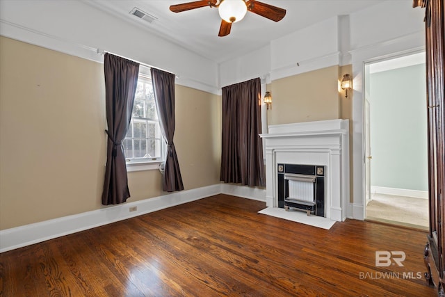 unfurnished living room featuring wood-type flooring and ceiling fan