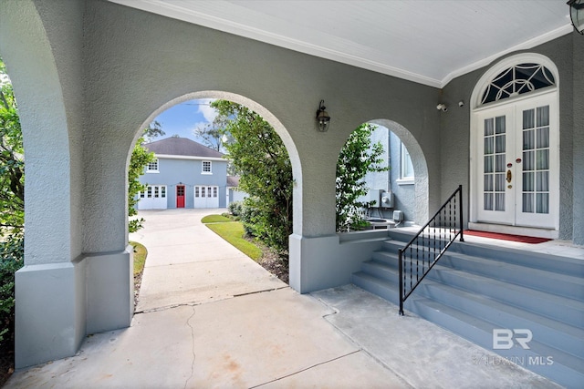 property entrance with french doors and a garage