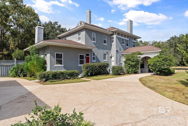 view of side of property with a yard