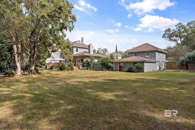 view of yard featuring a wooden deck