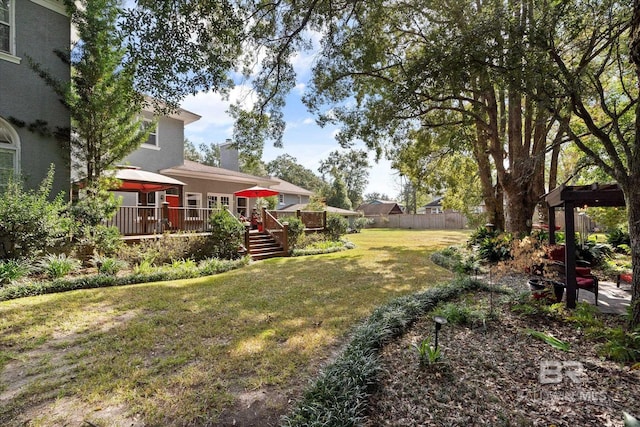 view of yard featuring a wooden deck and a gazebo