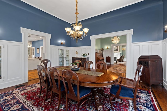 dining room featuring an inviting chandelier and dark hardwood / wood-style floors