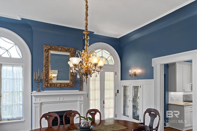 dining area with a healthy amount of sunlight and an inviting chandelier