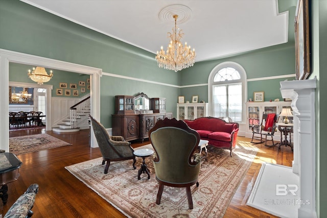 living room with an inviting chandelier and hardwood / wood-style floors