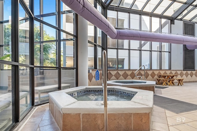 view of swimming pool featuring an indoor in ground hot tub