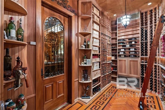 wine room featuring parquet floors