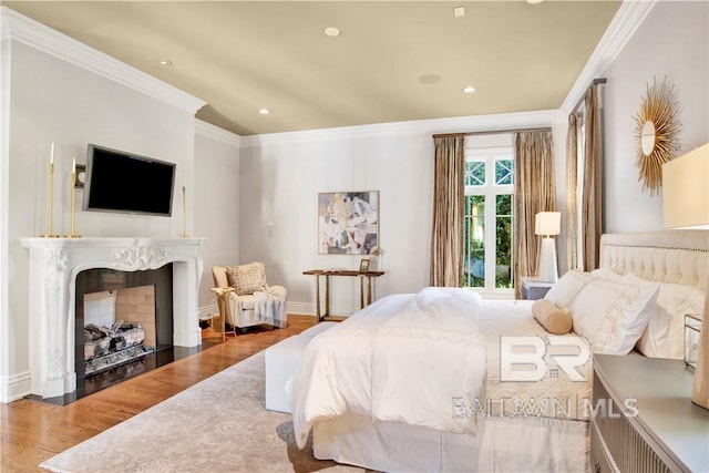 bedroom featuring ornamental molding and hardwood / wood-style floors