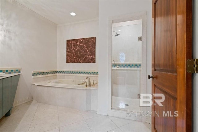 bathroom featuring ornamental molding, tile patterned flooring, independent shower and bath, and vanity