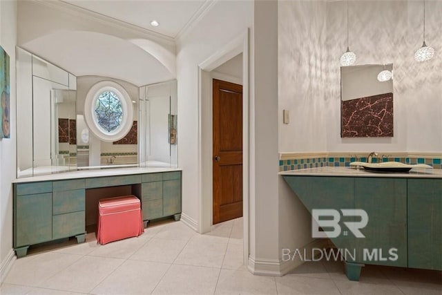 bathroom featuring ornamental molding, tile patterned floors, and vanity