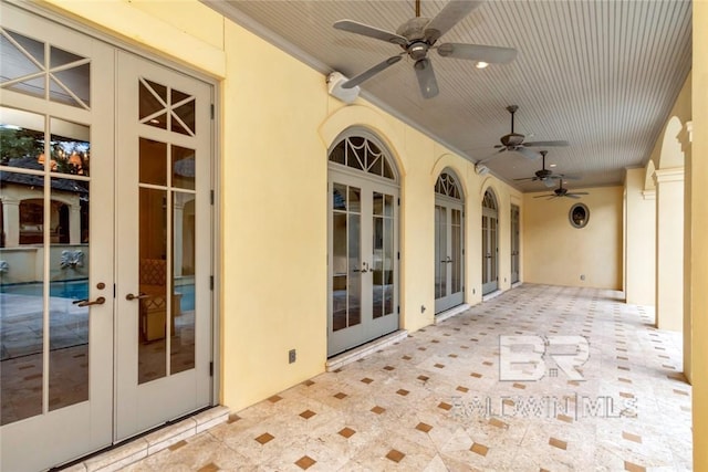 view of patio with ceiling fan and french doors