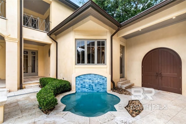 property entrance with french doors