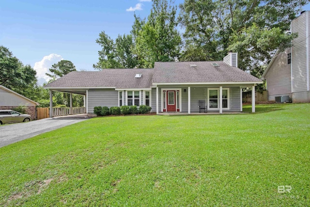 521 Parkwood Ave, Daphne, AL 36526 - view of front of home with covered porch, driveway, a chimney, a carport, and roof with shingles