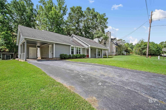 521 Parkwood Ave, Daphne, AL 36526 - ranch-style home with asphalt driveway, a front lawn, a shingled roof, and a carport