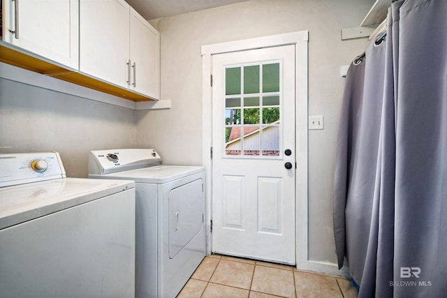 521 Parkwood Ave, Daphne, AL 36526 - washroom with cabinet space, washing machine and clothes dryer, and light tile patterned flooring