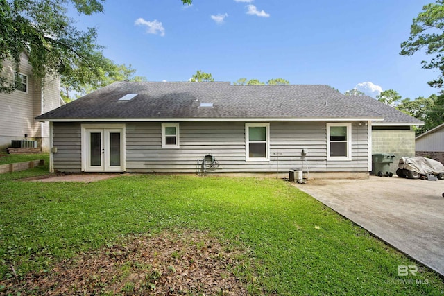 521 Parkwood Ave, Daphne, AL 36526 - back of house with french doors, a lawn, a shingled roof, and a patio area