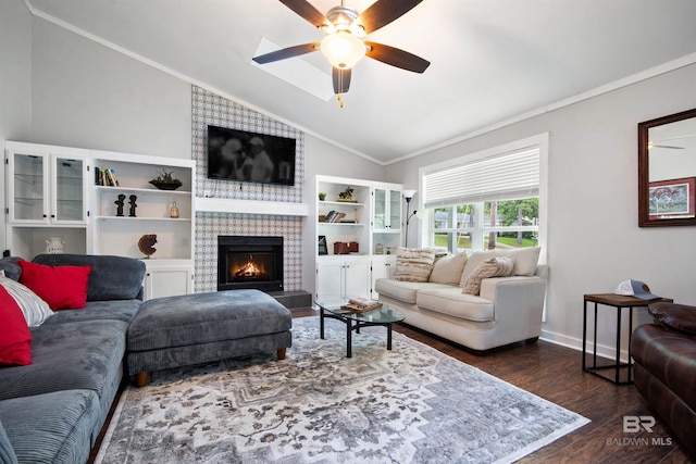 521 Parkwood Ave, Daphne, AL 36526 - living area with vaulted ceiling, dark wood finished floors, ceiling fan, a tile fireplace, and crown molding
