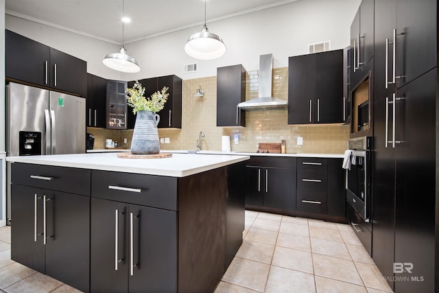 521 Parkwood Ave, Daphne, AL 36526 - kitchen with wall chimney range hood, stainless steel oven, a kitchen island, light countertops, and light tile patterned floors