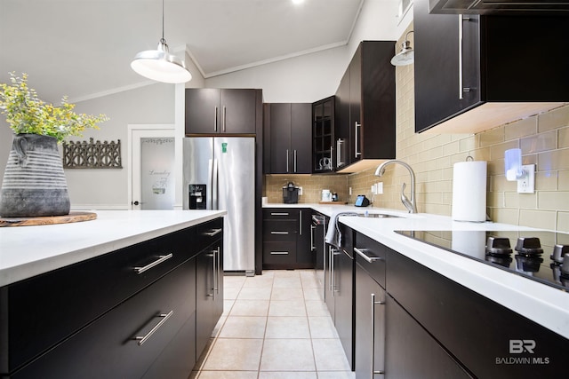 521 Parkwood Ave, Daphne, AL 36526 - kitchen featuring stainless steel fridge, crown molding, backsplash, light countertops, and lofted ceiling