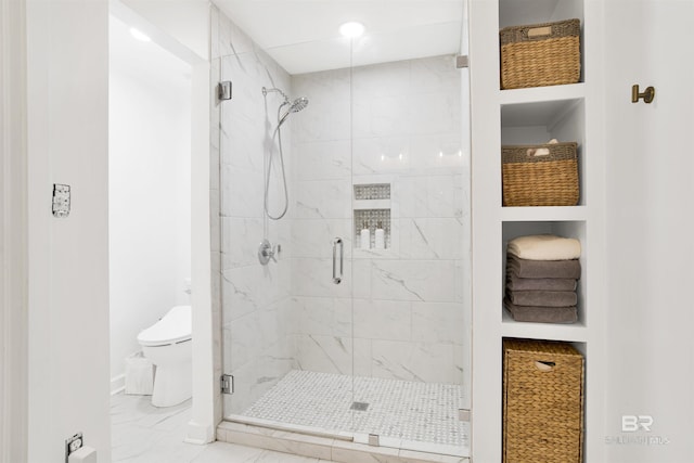 full bath with baseboards, a shower stall, toilet, and marble finish floor