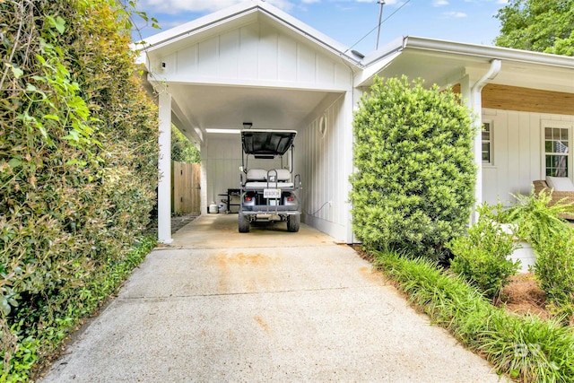 view of car parking featuring fence and driveway