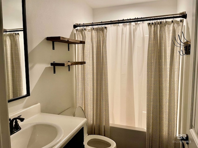 full bathroom with toilet, vanity, and shower / bath combo with shower curtain