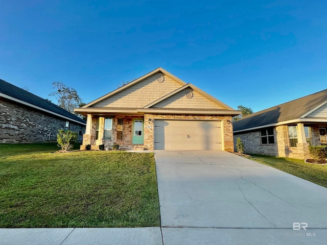 craftsman-style home with a garage and a front lawn