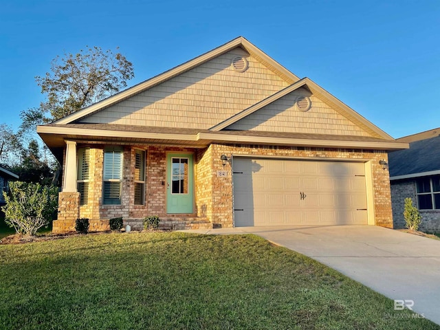 craftsman-style house featuring a front yard and a garage