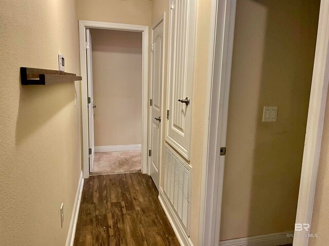 hallway featuring dark hardwood / wood-style floors